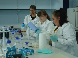Discussing sterile techniques with lab volunteers in Liverpool